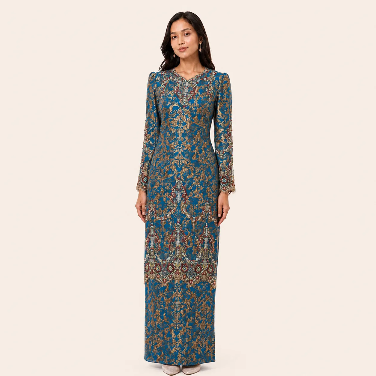 Istana kurung in teal silk with ornate gold embroidery and scalloped neckline